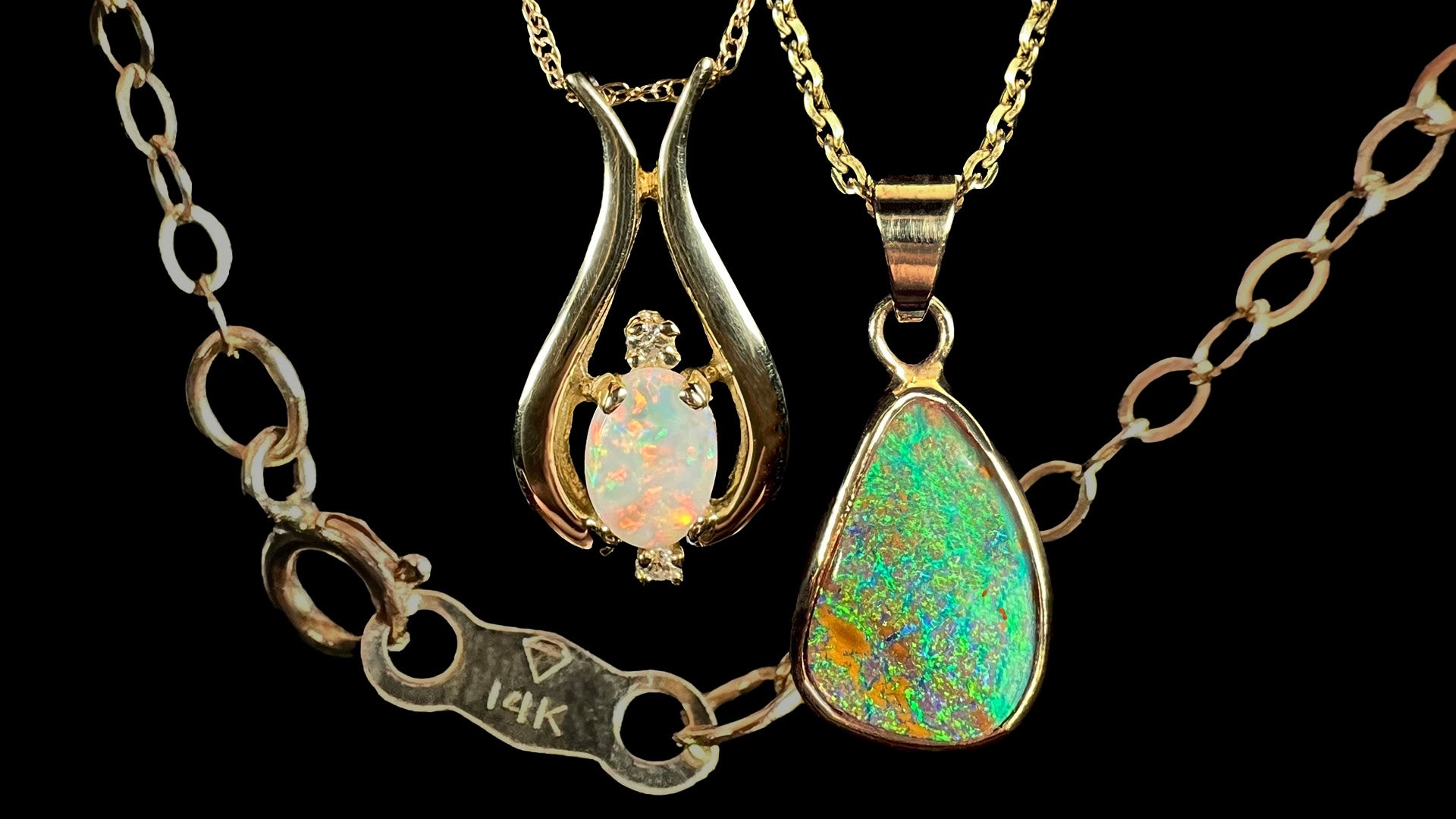 Two 14k gold Australian opal necklaces shown in front of faded gold chain showing tag with "14K" hallmark stamp.