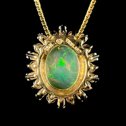 Back side of yellow gold Ethiopian opal pendant showing stamps "14K" and "THAILAND".