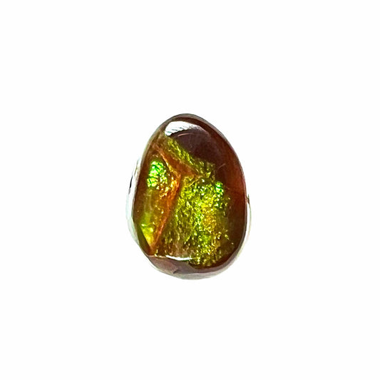 A loose, pear shaped Mexican fire agate cabochon.  The stone is glittery green with an orange streak.