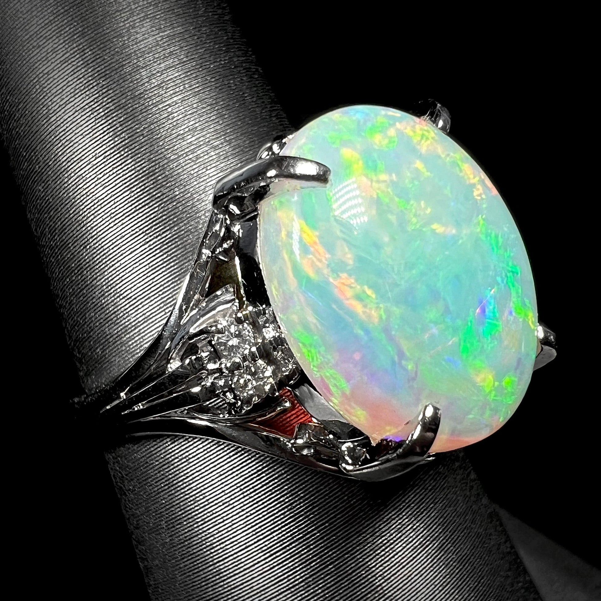 A 4.83ct Coober pedy opal engagement ring set with diamonds in platinum.