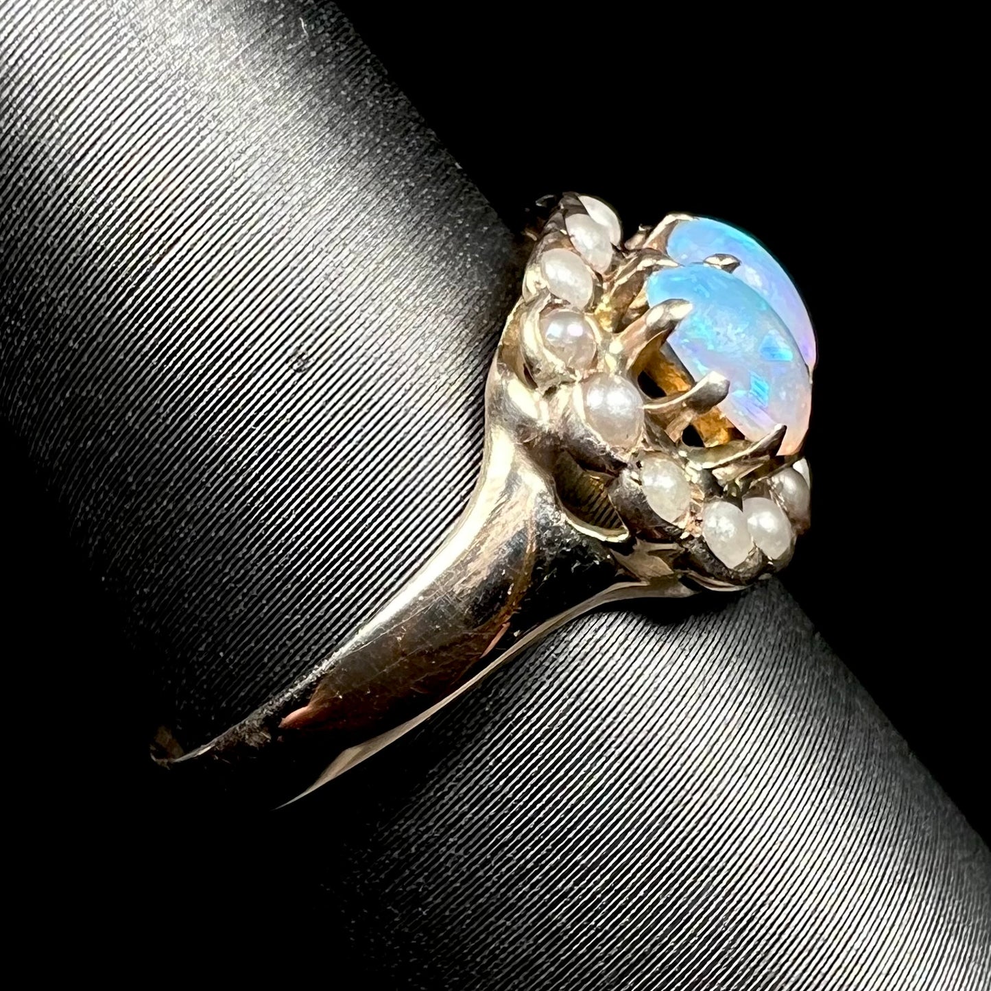 9k gold Victorian opal and pearl ring shown from side, focusing on ring's shank