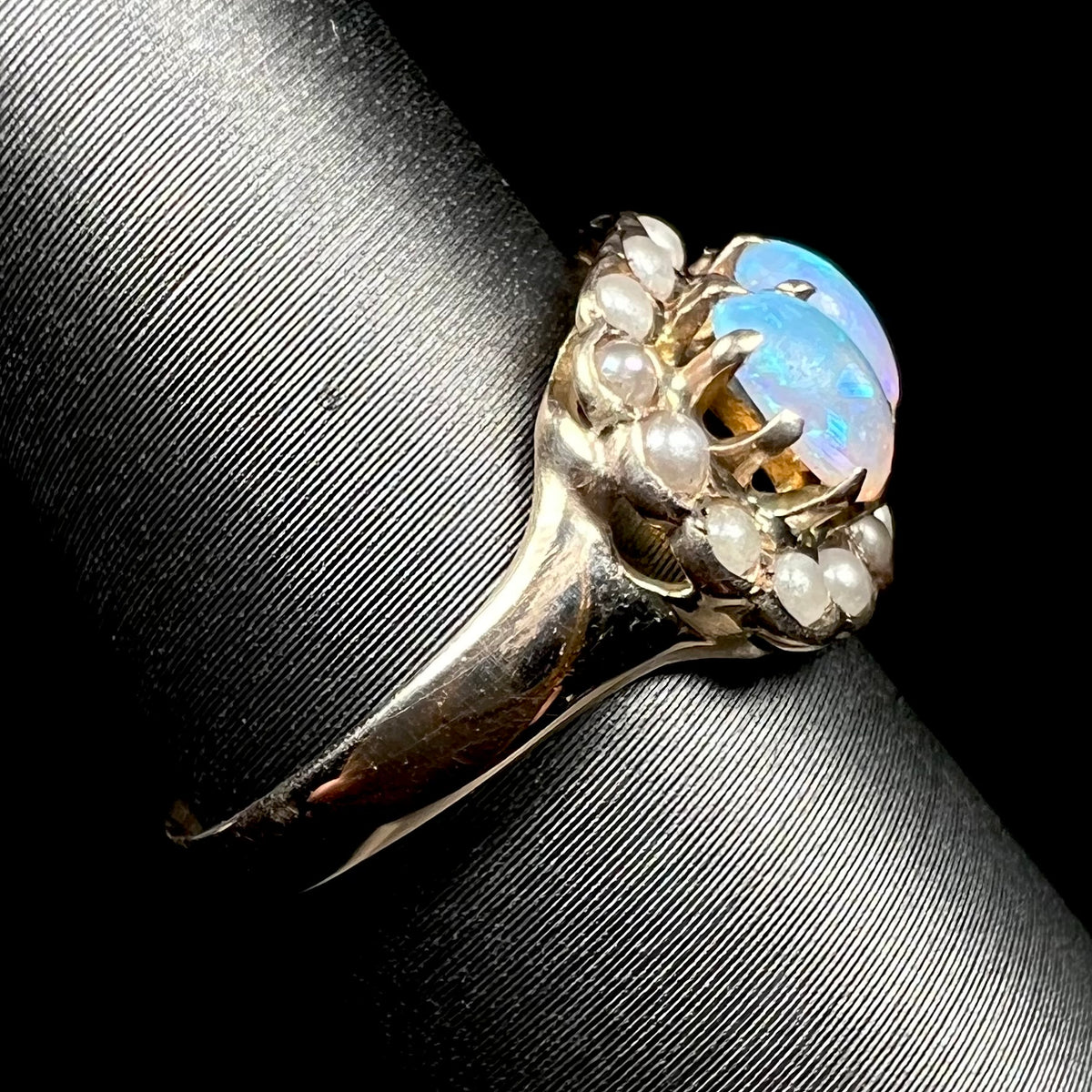 9k gold Victorian opal and pearl ring shown from side, focusing on ring's shank