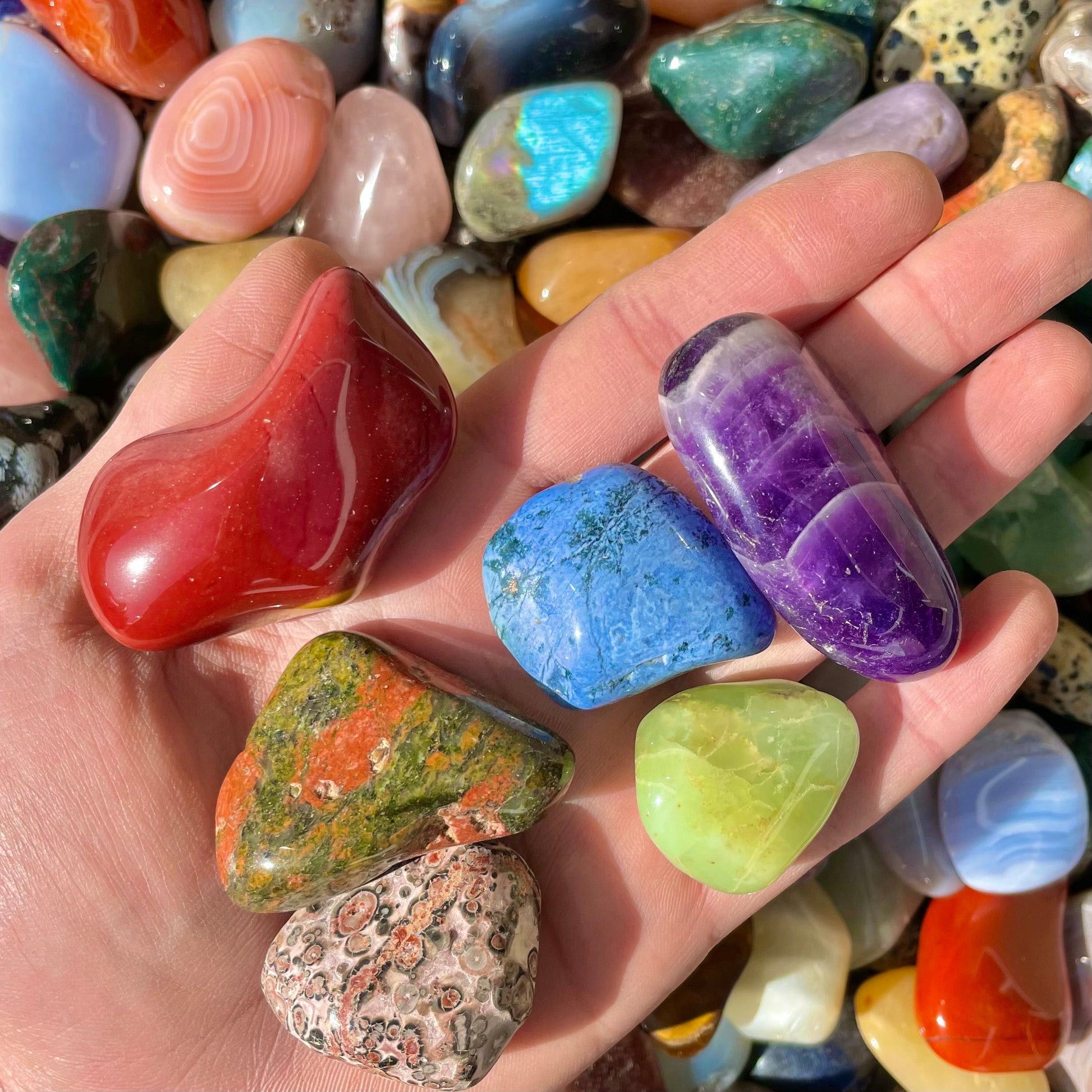 Handful of large polished healing crystals.  Various natural colors of quartz.