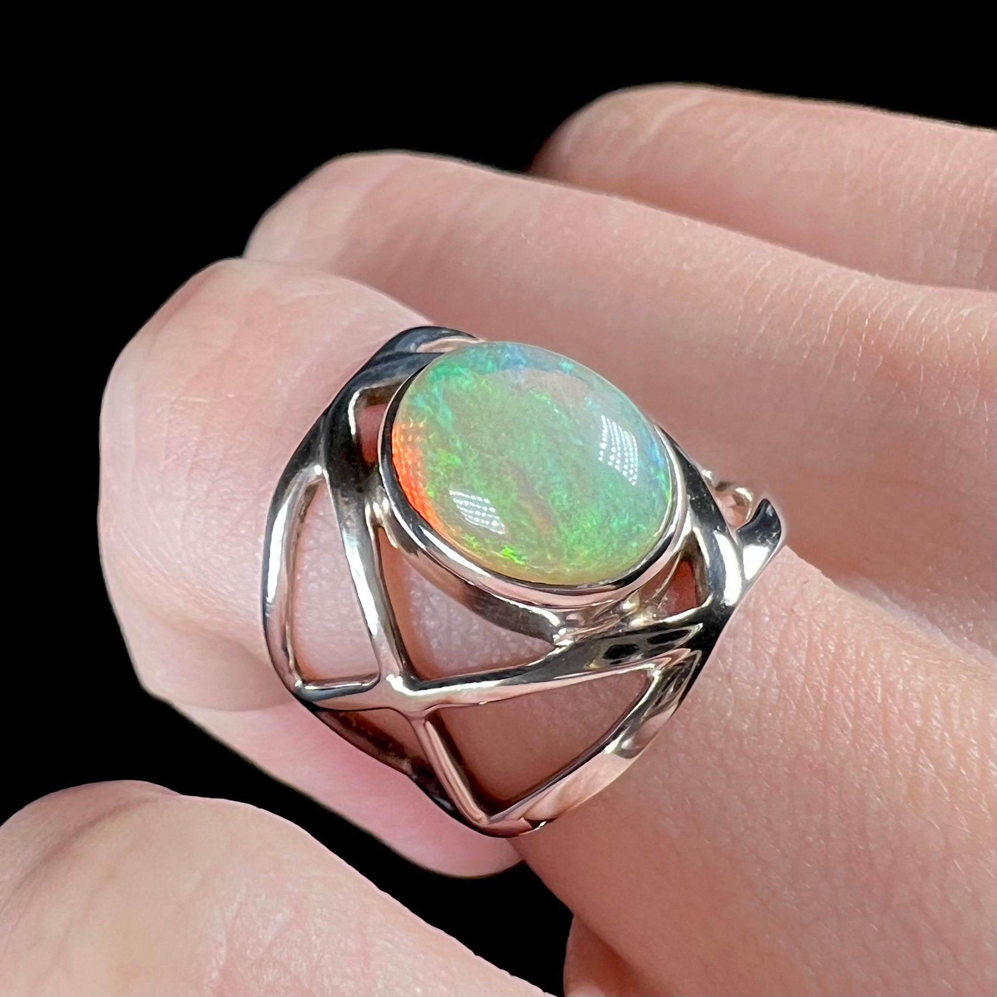 An angled view of an Ethiopian opal ring made from sterling silver.