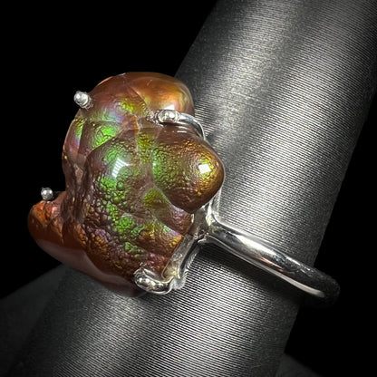 Angled view of the Arizona fire agate ring showing green and purple iridescence.