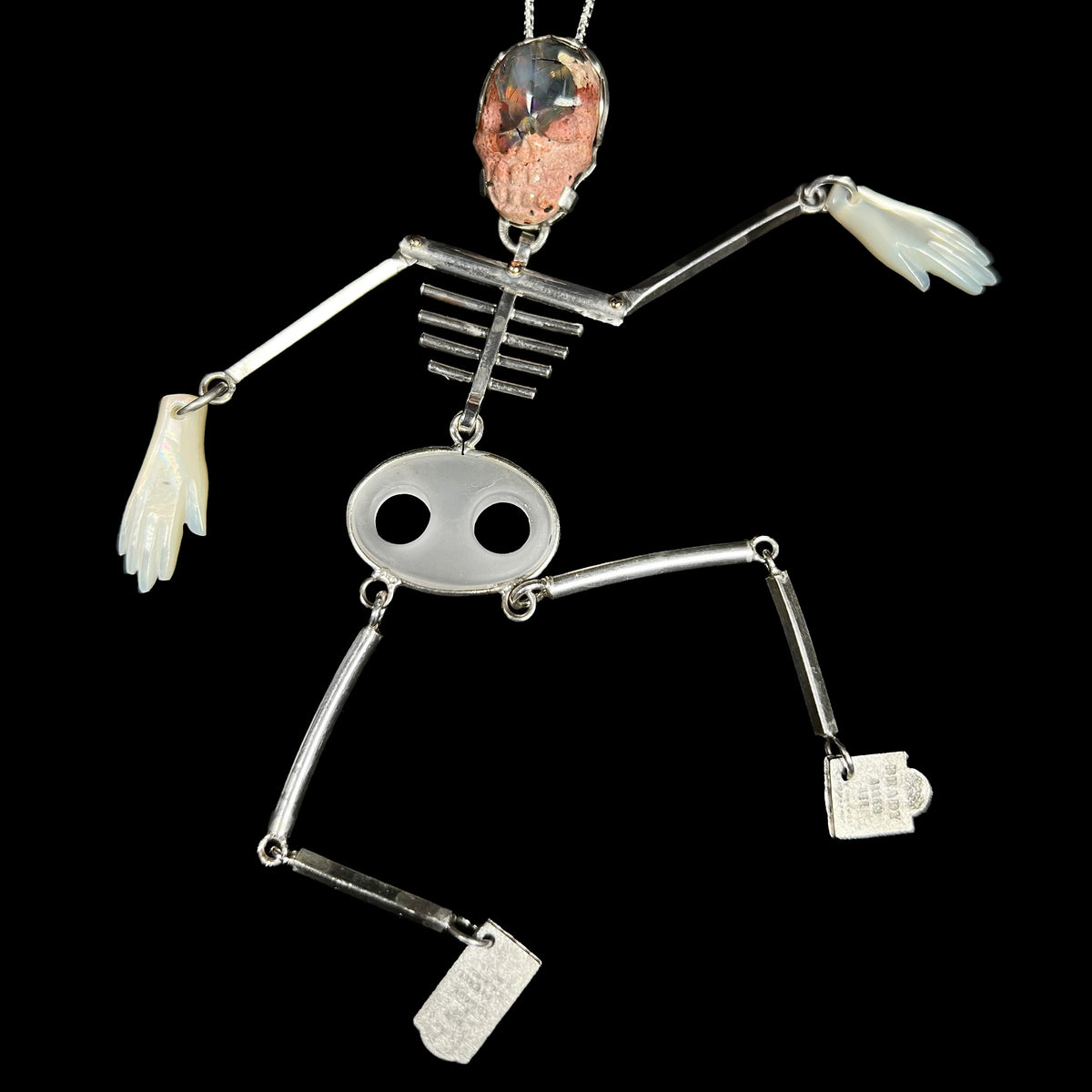 Large sterling silver skeleton pendant with articulated, moving bones, a carved Mexcian cantera matrix opal skull, mother of pearl hands, and tombstone feet