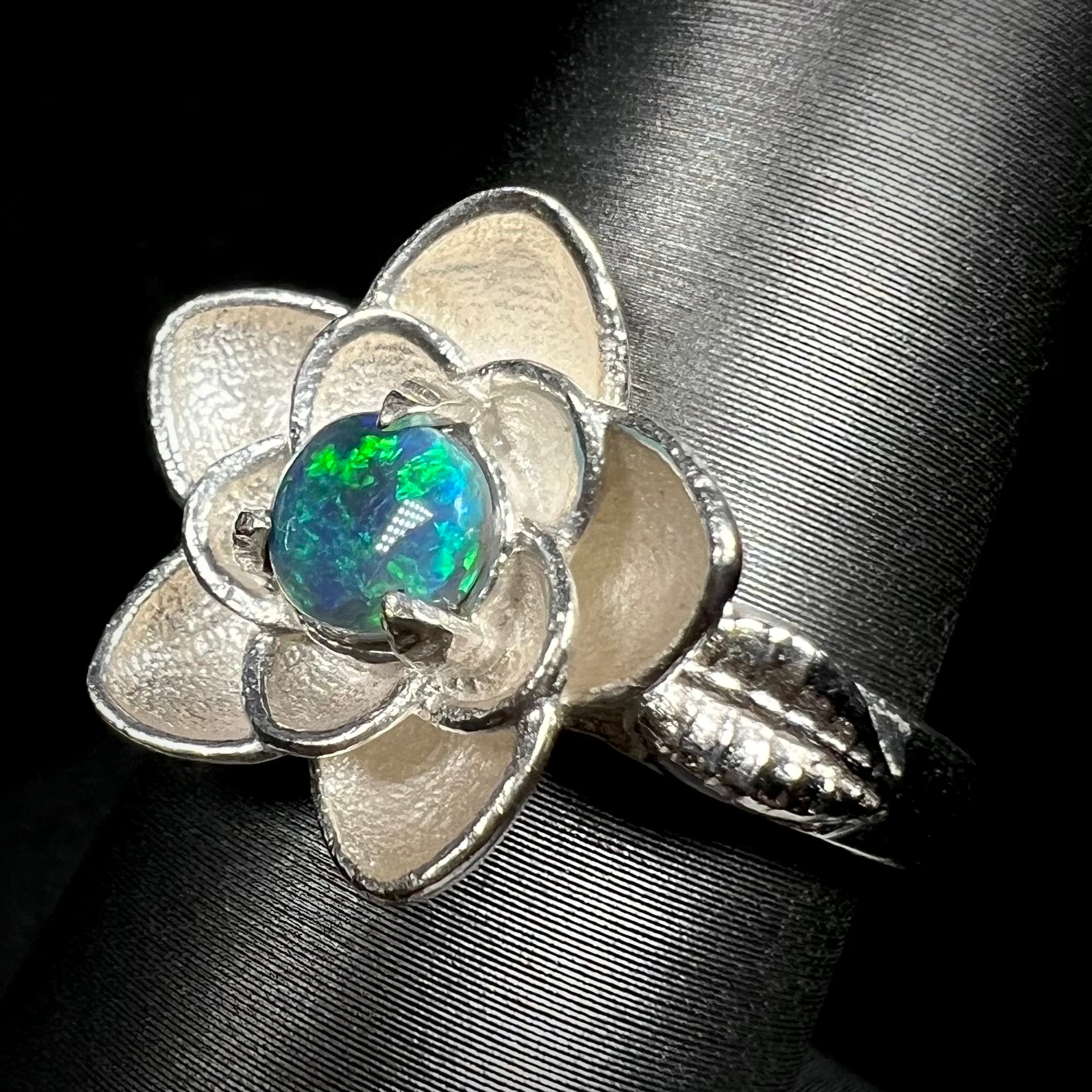 Australian black opal flower design solitaire ring on ring display