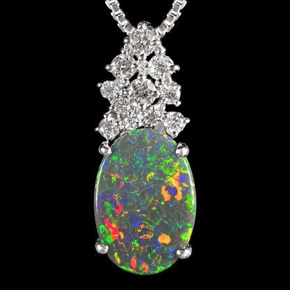 Close-up of a Japanese platinum pineapple pendant with a 2.65ct Australian black opal, red-orange multicolor play-of-color, and diamond crown.