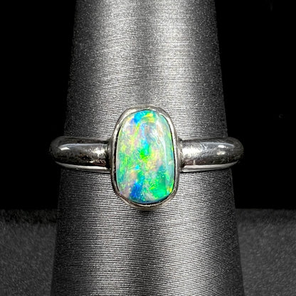 Handmade silver Australian crystal opal solitaire ring shown close-up on ring display