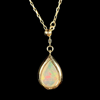 Back view of the opal necklace, showing the ‘K10’ gold stamp and the open-back bezel setting.