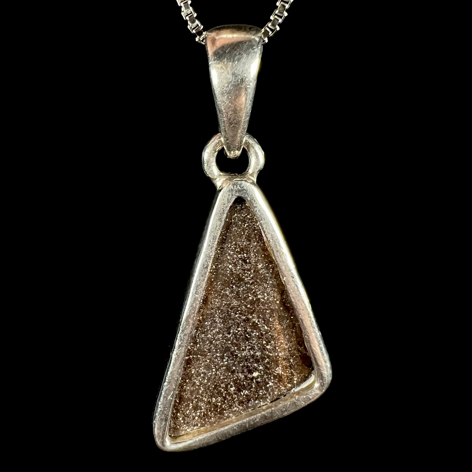 Back side of a .950 silver Australian boulder opal pendant, shown against a black background.