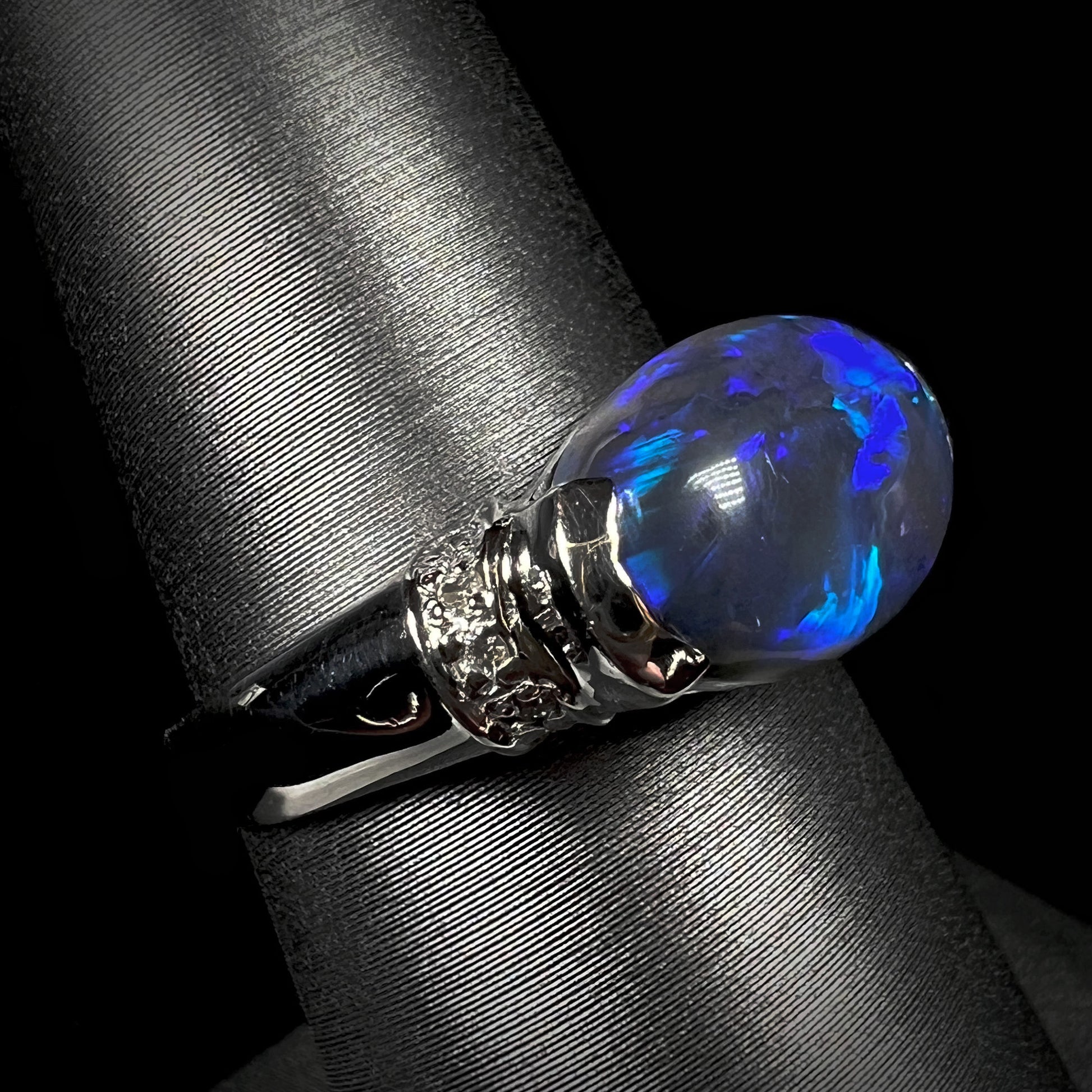 A 3.18ct black opal and diamond ring cast in platinum.