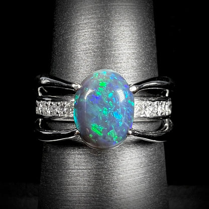 A 1.88ct Lightning Ridge black opal ring in solid platinum with diamond accents.