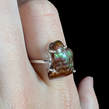 Opposite angled view showing blue and subtle purple iridescence in the fire agate stone.