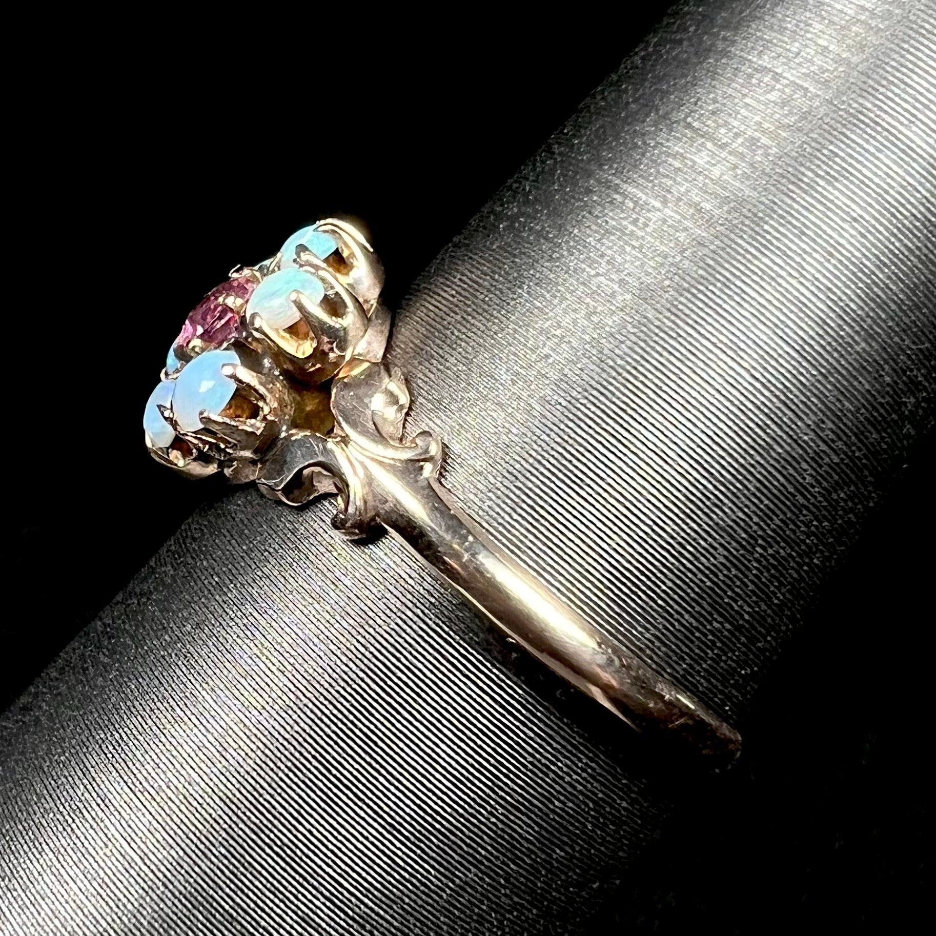 Side shank view of British 9k gold Victorian opal ring on ring display