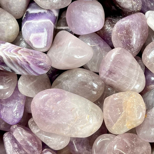 Palm sized, commercial grade, tumbled amethyst stones.