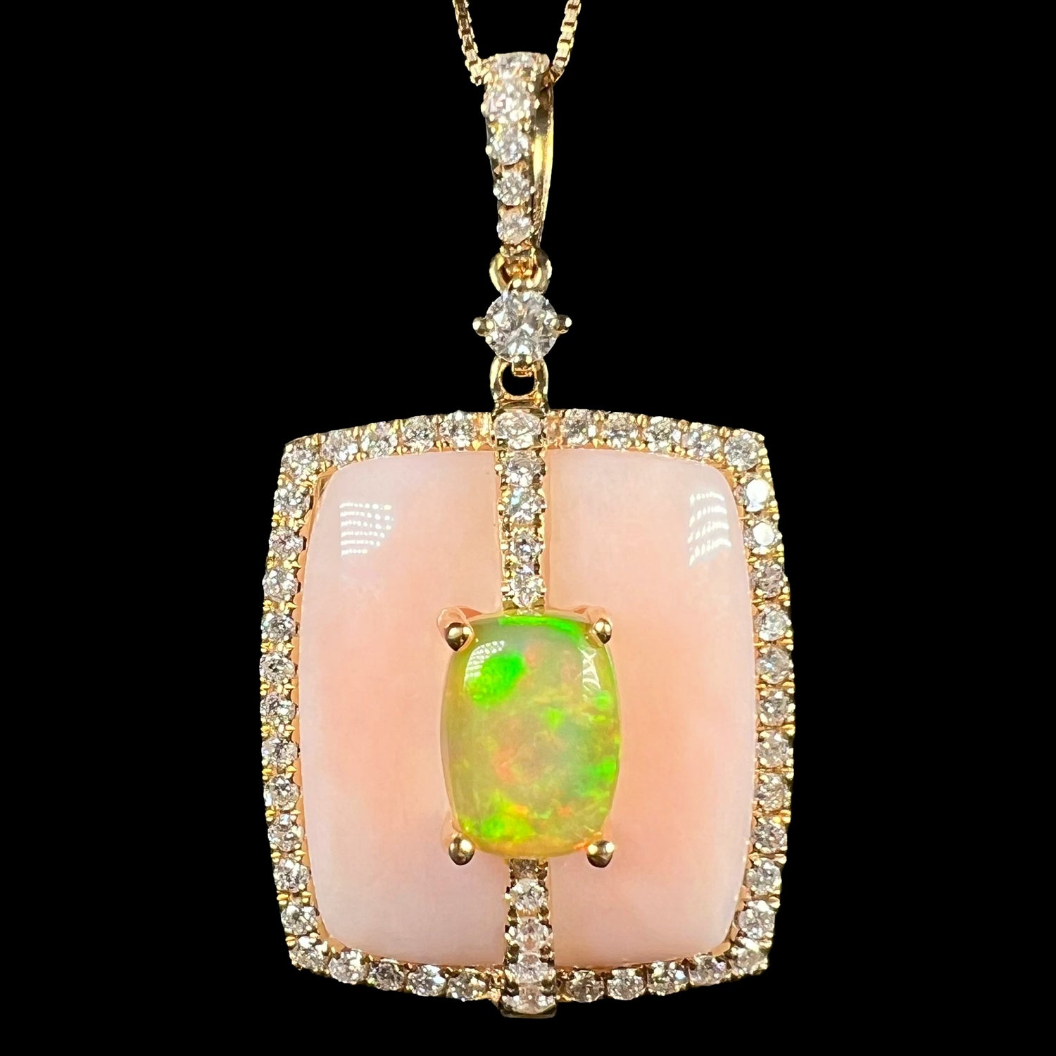 Close-up of Cirari brand women's 14k gold Ethiopian opal, Peruvian pink opal, and diamond halo necklace, shown against a black background.