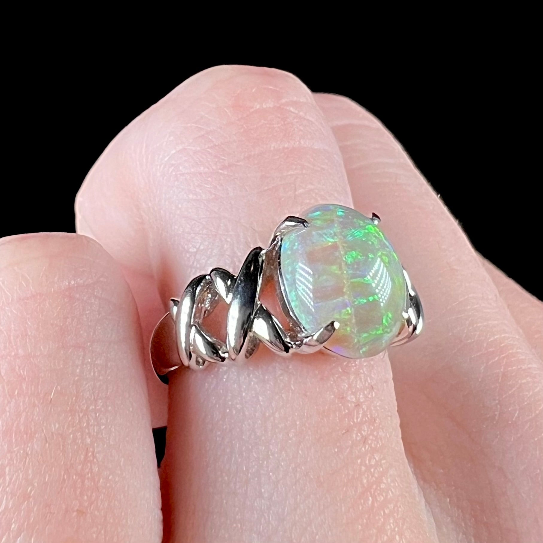 A Coober Pedy opal crisscross ring made from .900 platinum.