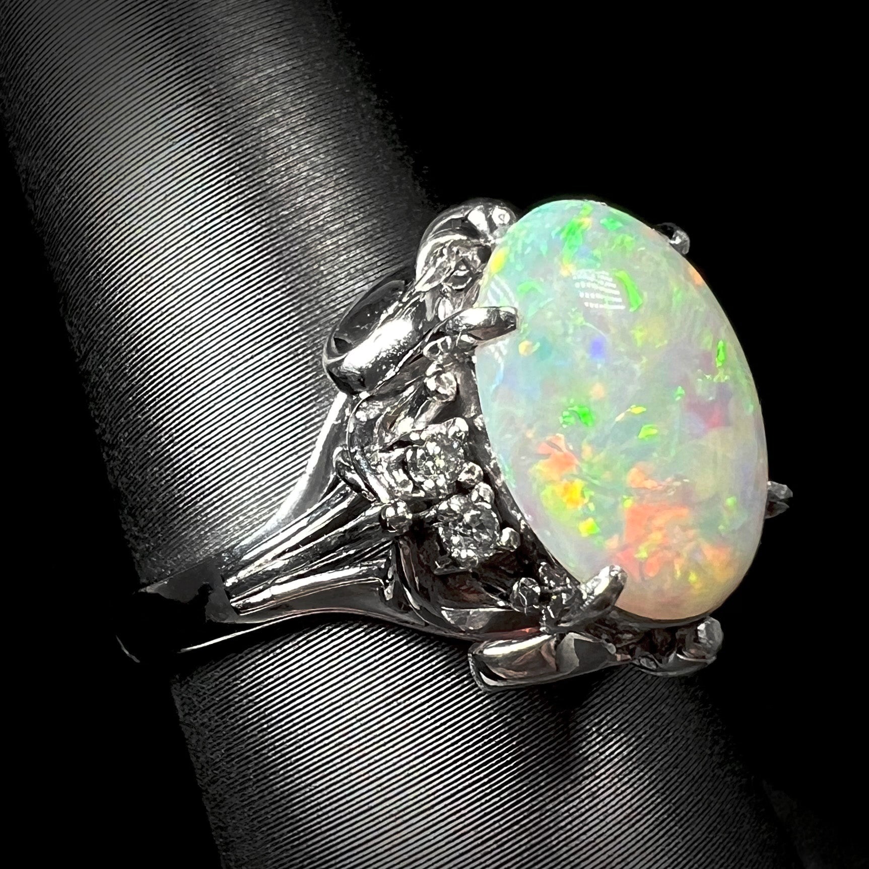 A platinum ring set with a Coober Pedy opal and diamonds.  The ring is an ornate Japanese style.