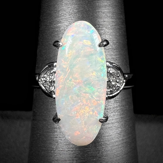 A simple, contemporary style platinum ring set with a white Coober Pedy opal and diamonds.