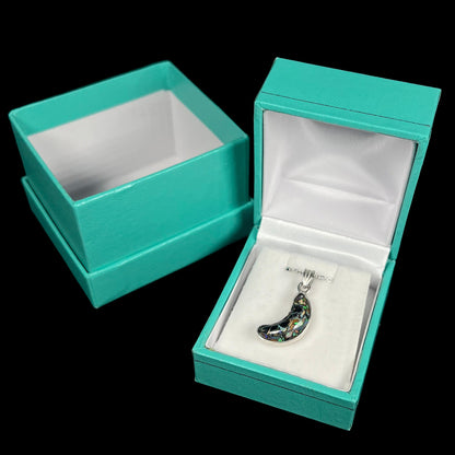 A sterling silver necklace bezel set with a natural Koroit boulder opal stone.  The stone is shaped like a crescent moon.