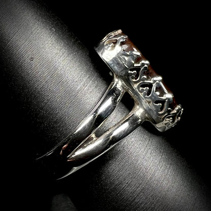 Side view of crown-design ring made from sterling silver with a split shank.  The shank is in focus.