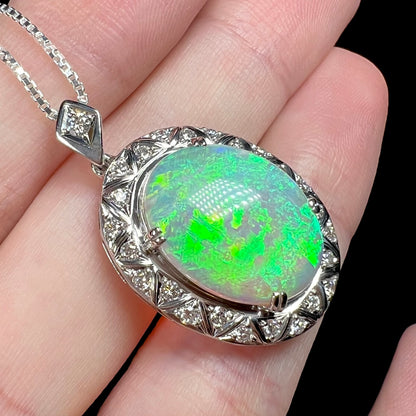 Angled macro shot of crystal opal pendant showing a vibrant green flash.