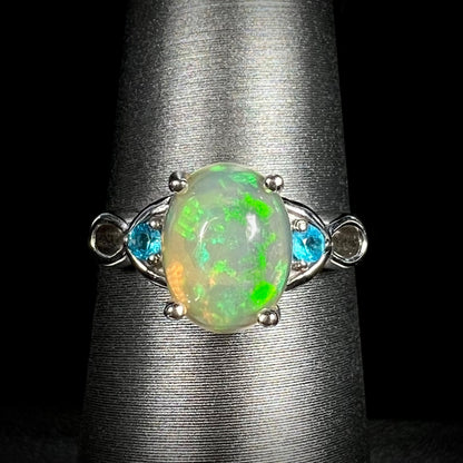 Women's sterling silver Ethiopian opal ring with blue apatite accents on ring display