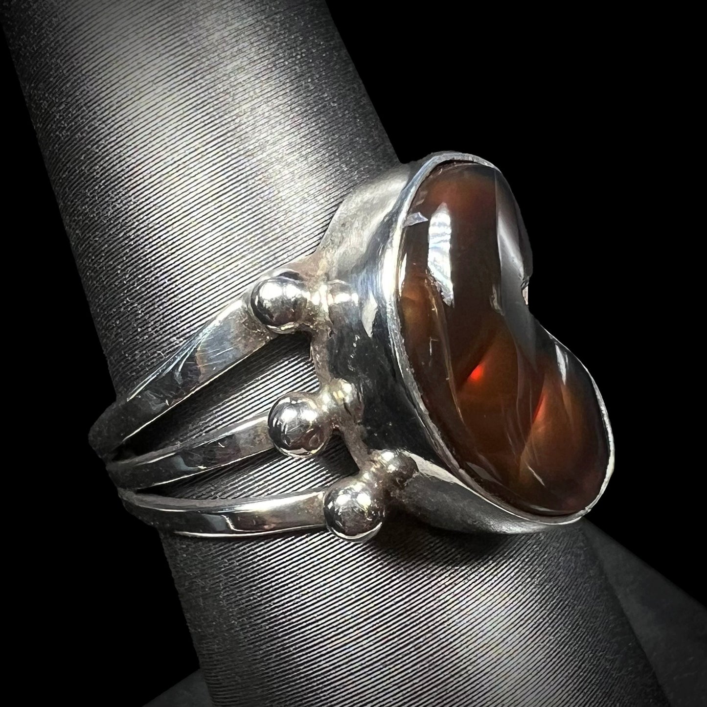 Alternate side of the brown fire agate ring with visible red flash.