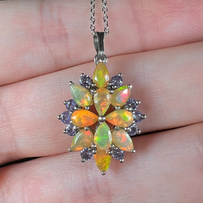 Close-up front view of an Ethiopian fire opal necklace with tanzanite accents.