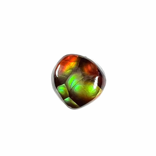 A loose, cabochon cut Mexican fire agate gemstone.  The stone is small and exceptionally bright in the sunlight.