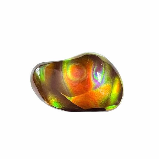 A loose, imperial grade Mexican fire agate gemstone.  The stone has a bull's eye pattern.