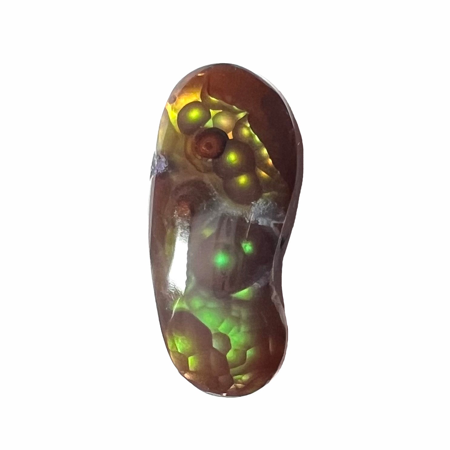 A loose, cabochon cut fire agate gemstone.  The stone resembles a foot with a green heel and yellow toes.