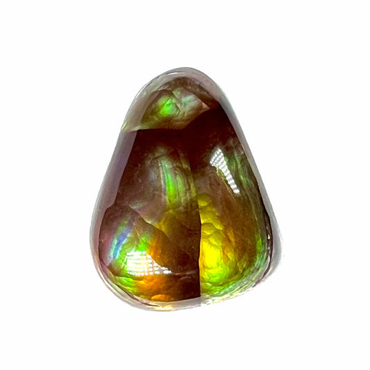 A freeform shaped fire agate cabochon with green and red iridescence.