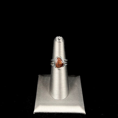 A ladies' fire agate ring set in a split-shank sterling silver mounting.