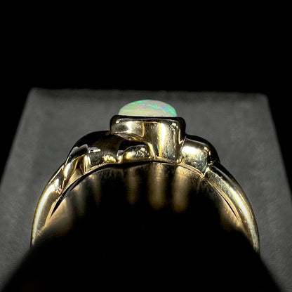 The gallery view of a gold opal ring.  The ring is simple, smooth, and polished.