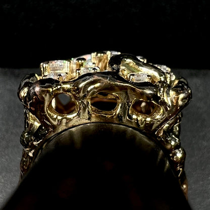 Gallery view of gold-plated brutalist-style men's ring set with cubic zirconia stones, shown on ring display.