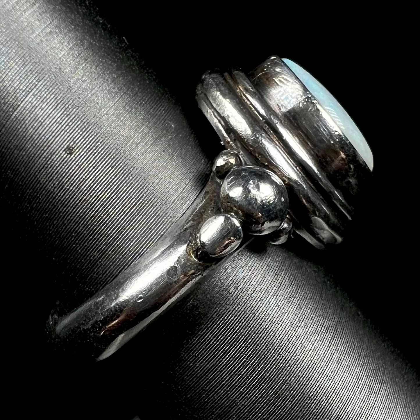 Side view of a handmade silver Boho-style ring set with an Australian light opal.