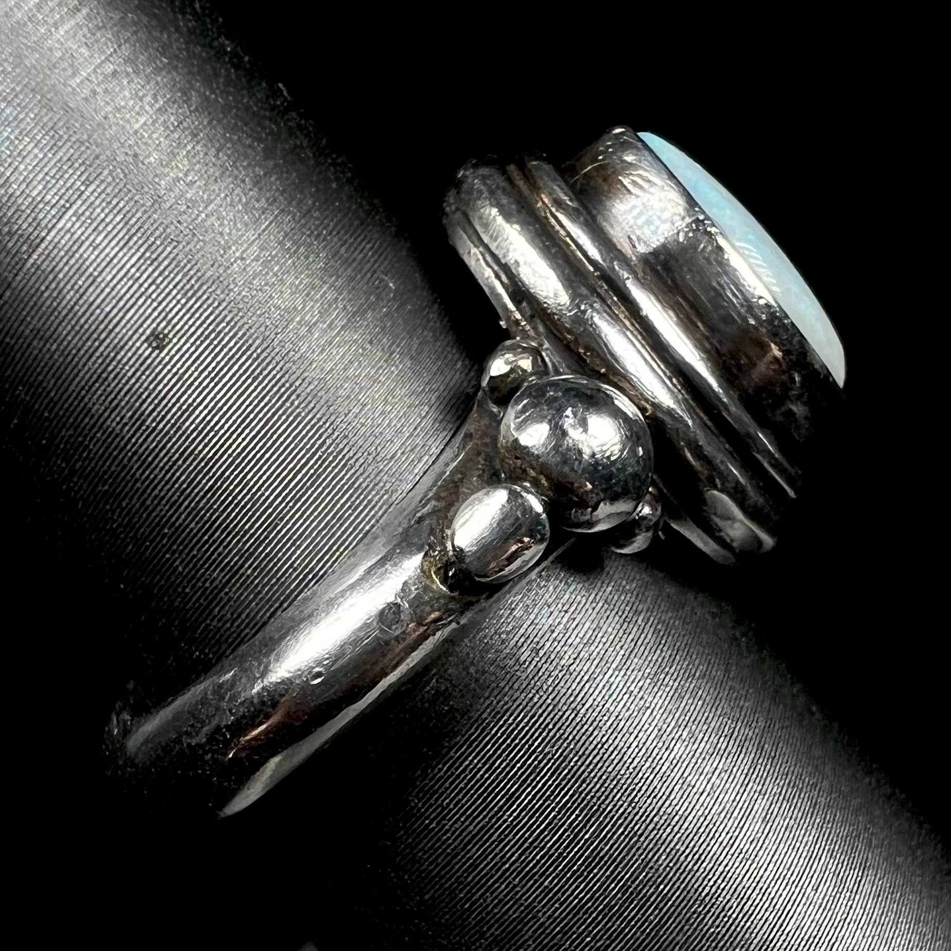 Side view of a handmade silver Boho-style ring set with an Australian light opal.