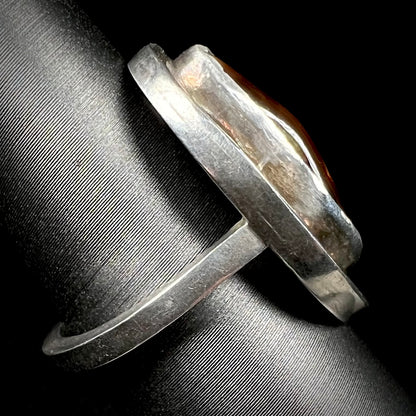 Side view of a handmade sterling silver fire agate ring.