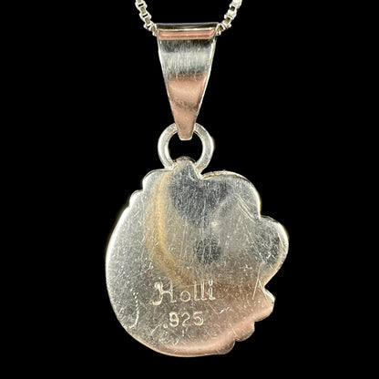 Back side of handmade sterling silver pendant showing hallmark stamps "Holli" and ".925".