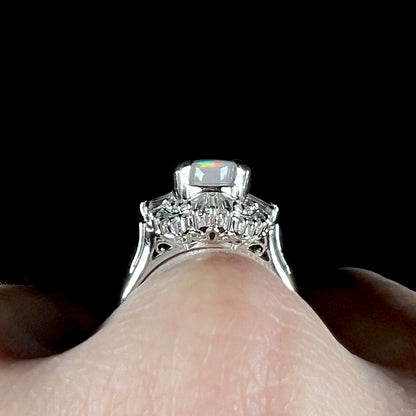 The gallery view of a Japanese-crafted platinum filigree and opal ring with diamond accents.