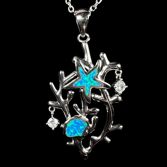 A silver plated coral reef necklace with blue lab-created opal inlay and CZ accents.
