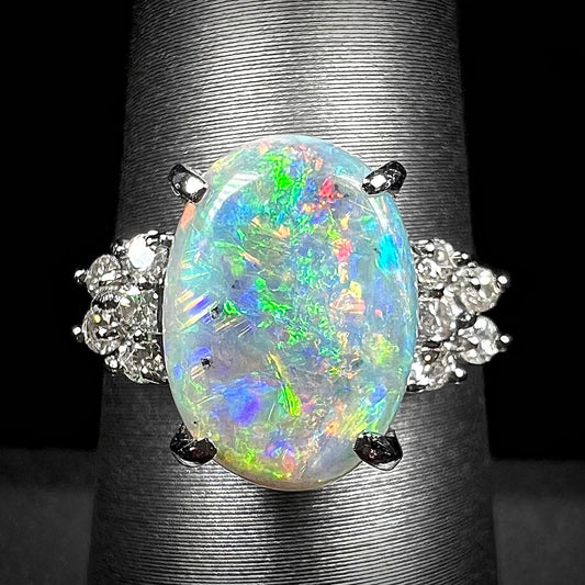 A multicolor Lightning Ridge opal and diamond-accented ring in platinum.