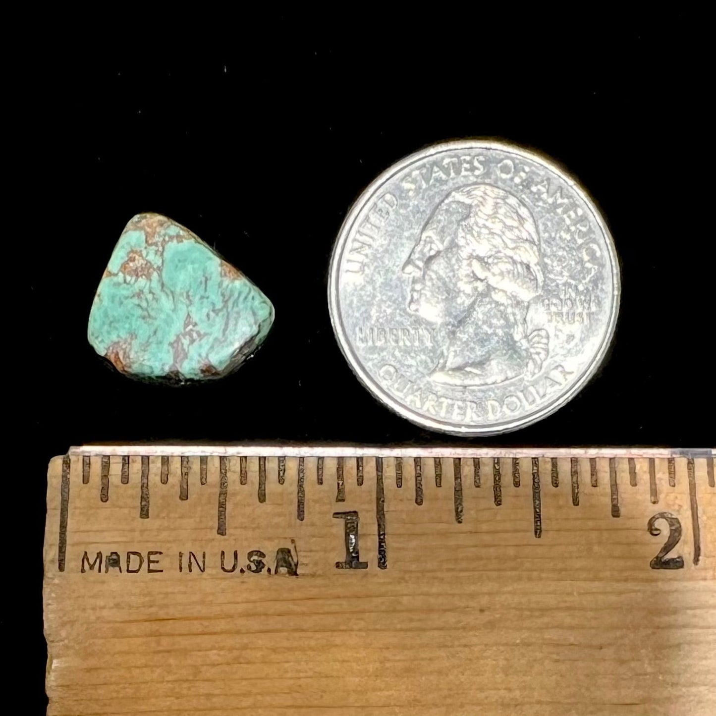 A loose greenish blue Royston turquoise stone from Nevada.  The stone has brown matrix.