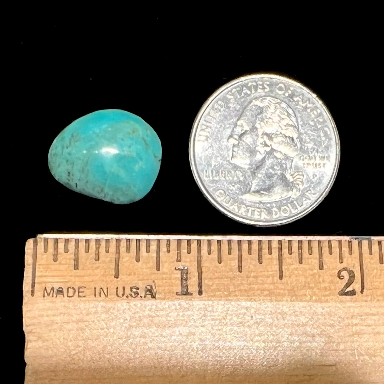 A loose, freeform pear shaped Pilot Mountain turquoise stone from Nevada.