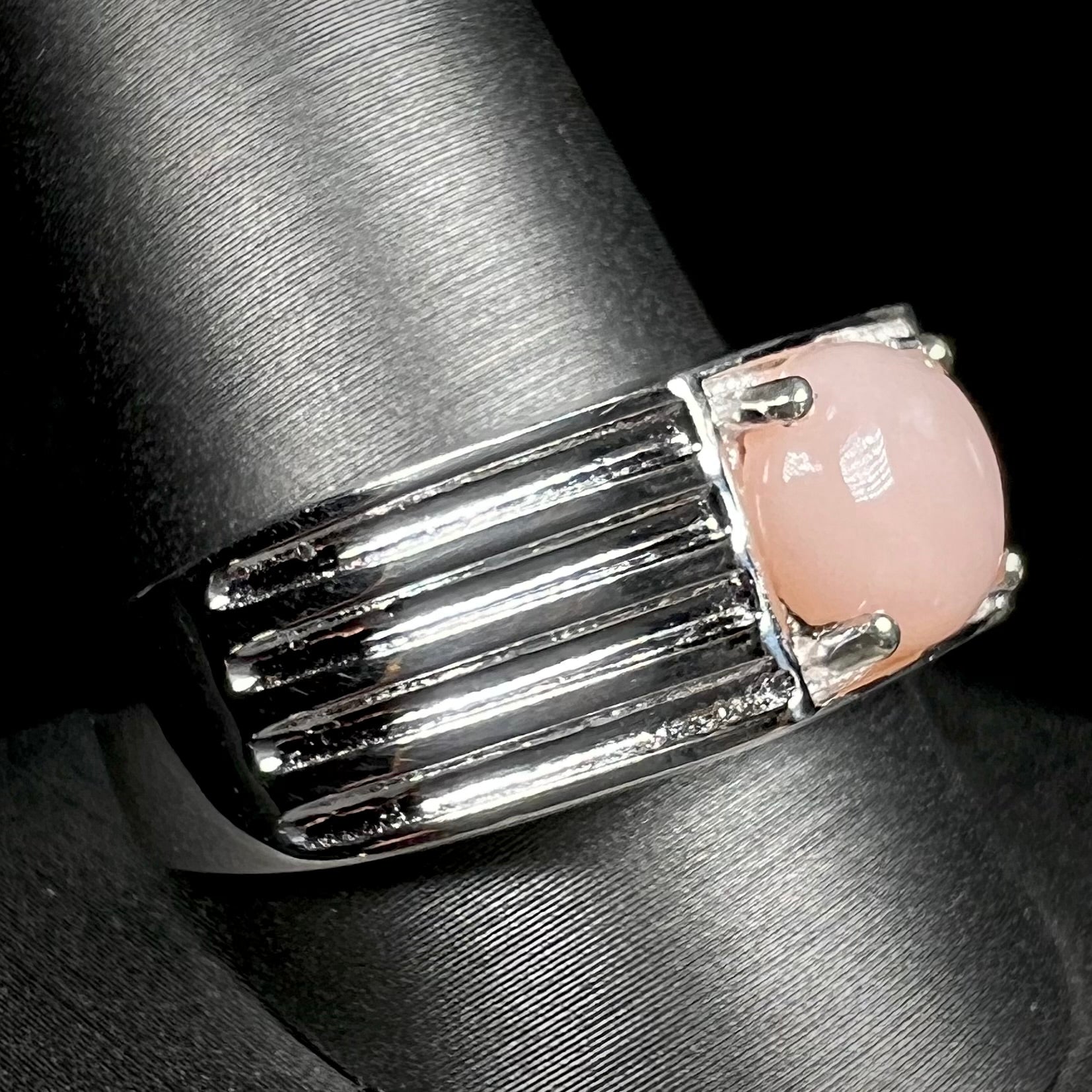 Sterling silver men's pink opal ring on ring display