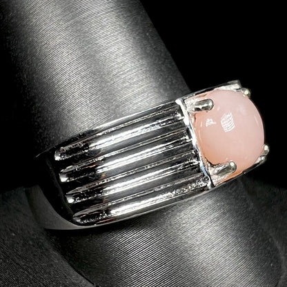 Sterling silver men's pink opal ring on ring display