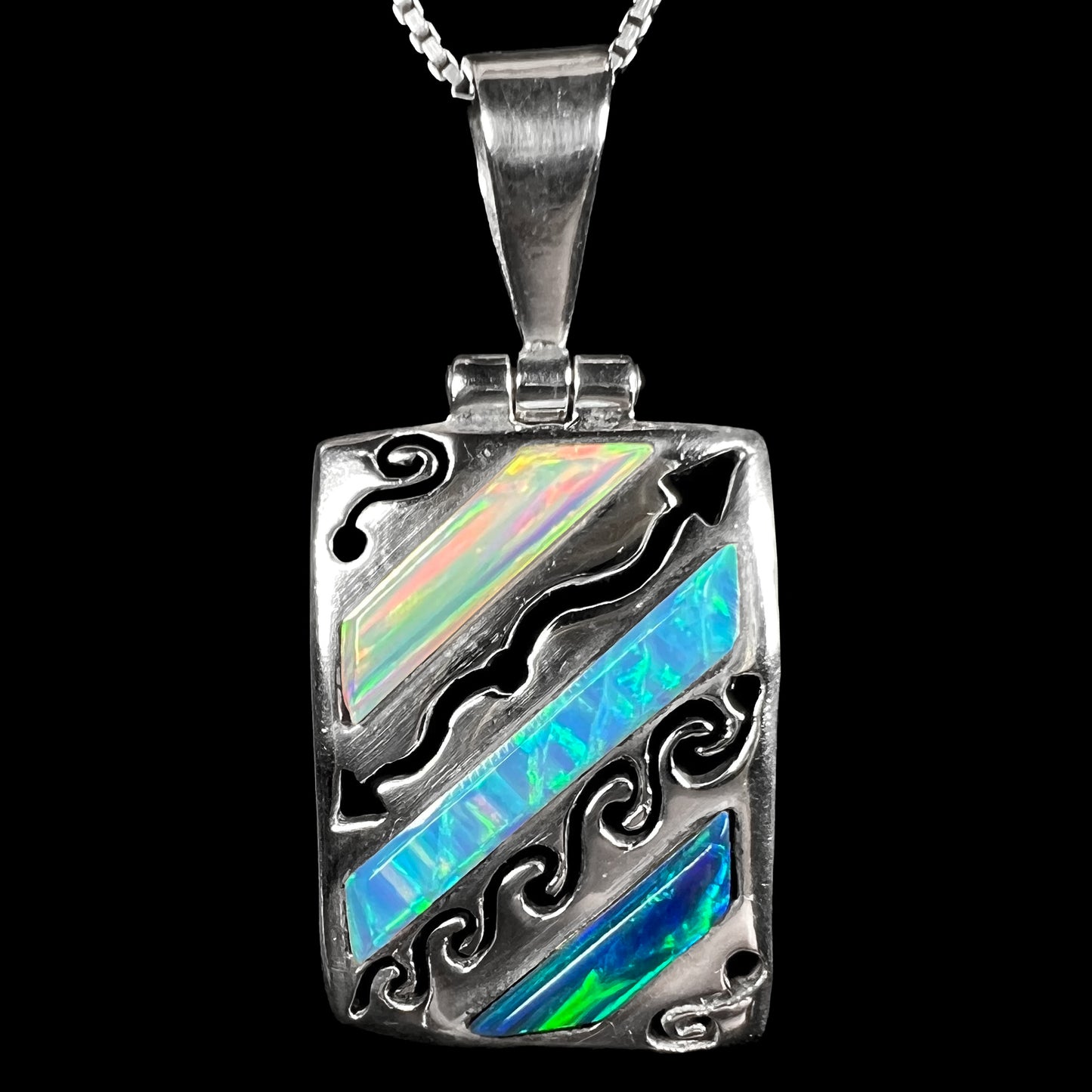 A men's Southwest-style 950 silver lab-created opal pendant, shown close-up against a black background.