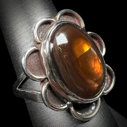 Fire agate ring showing brown stone with orange and yellow flashes.